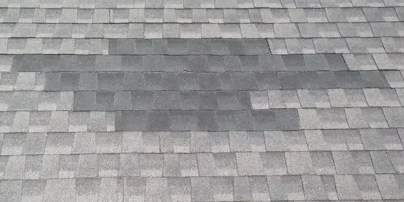 Shingle repair showing new shingles not matching old shingles