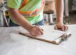 Roofing supervisor taking notes on one day build.