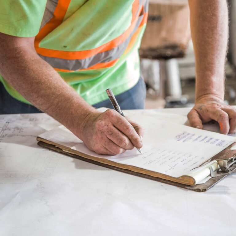 Roofing supervisor taking notes on one day build.