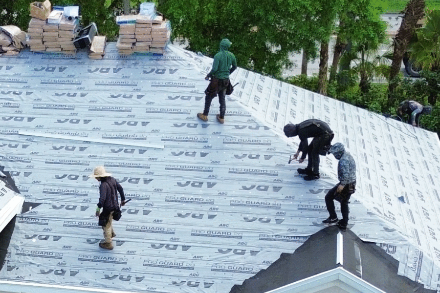 Native Sons roofers working on installing the underlayment of a shingle roof